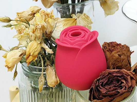 A red rose toy and some flower